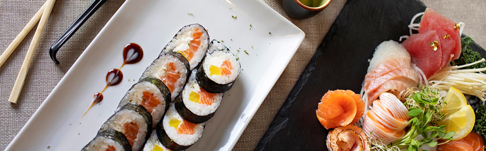 A plate of tempura rolls, with spicy sashimi