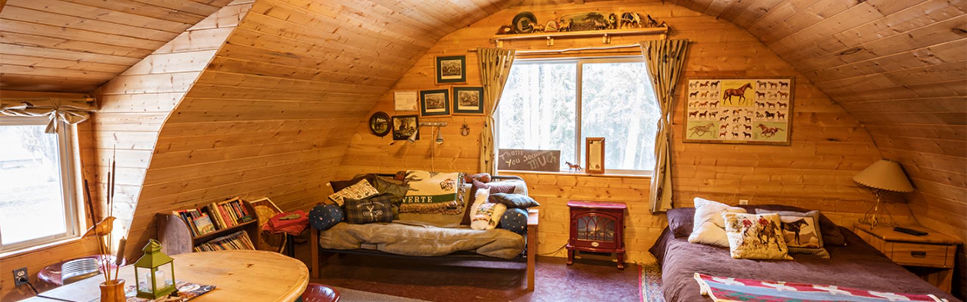 Spacious and king size bedroom with seating and dining area and Wood-burning stove