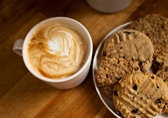 A cup of Espresso Coffee with assorted cookies  