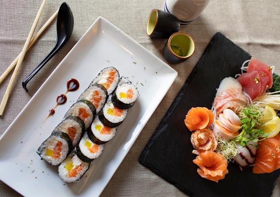 A plate of tempura rolls, with spicy sashimi